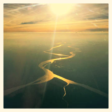 Rio Parana Guazu, reflecting the sun -- from an airplane, just north of Buenos Aires, Argentina